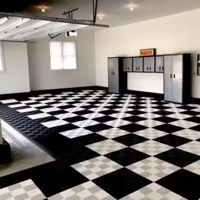 Black and white checkerboard garage flooring tiles installed
