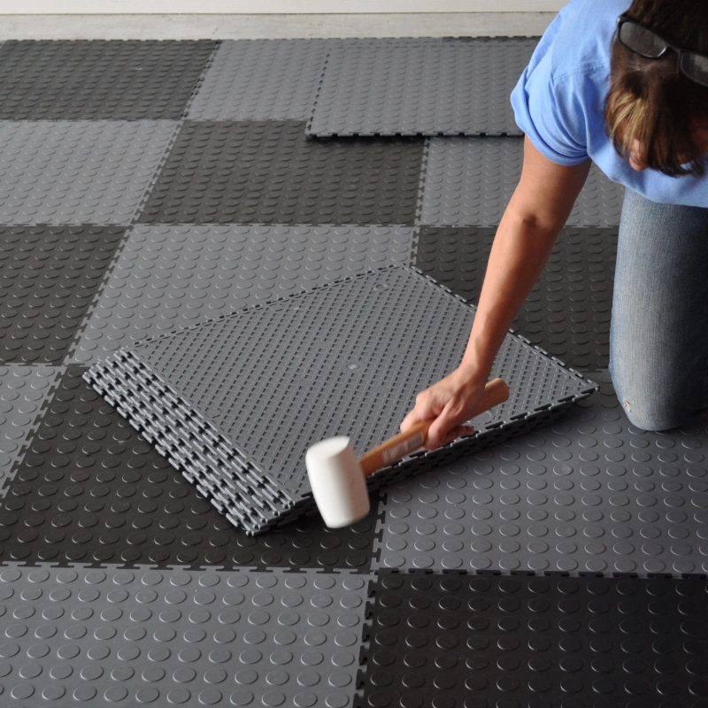 Garage floor tiles installation in progress