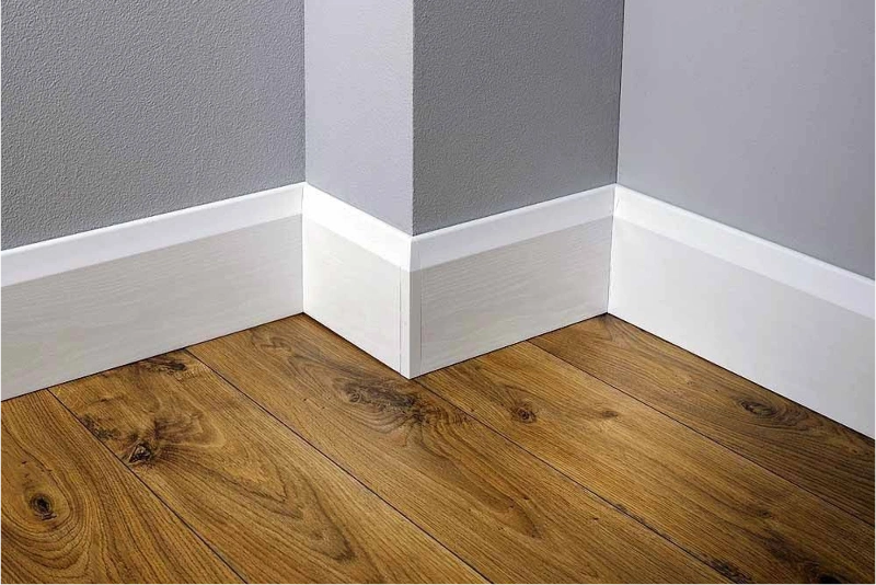 White wall skirting on wooden flooring